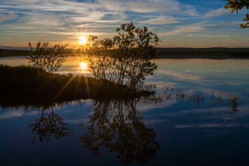 Photo of a sunset landscape in Rovaniemi, Finland.